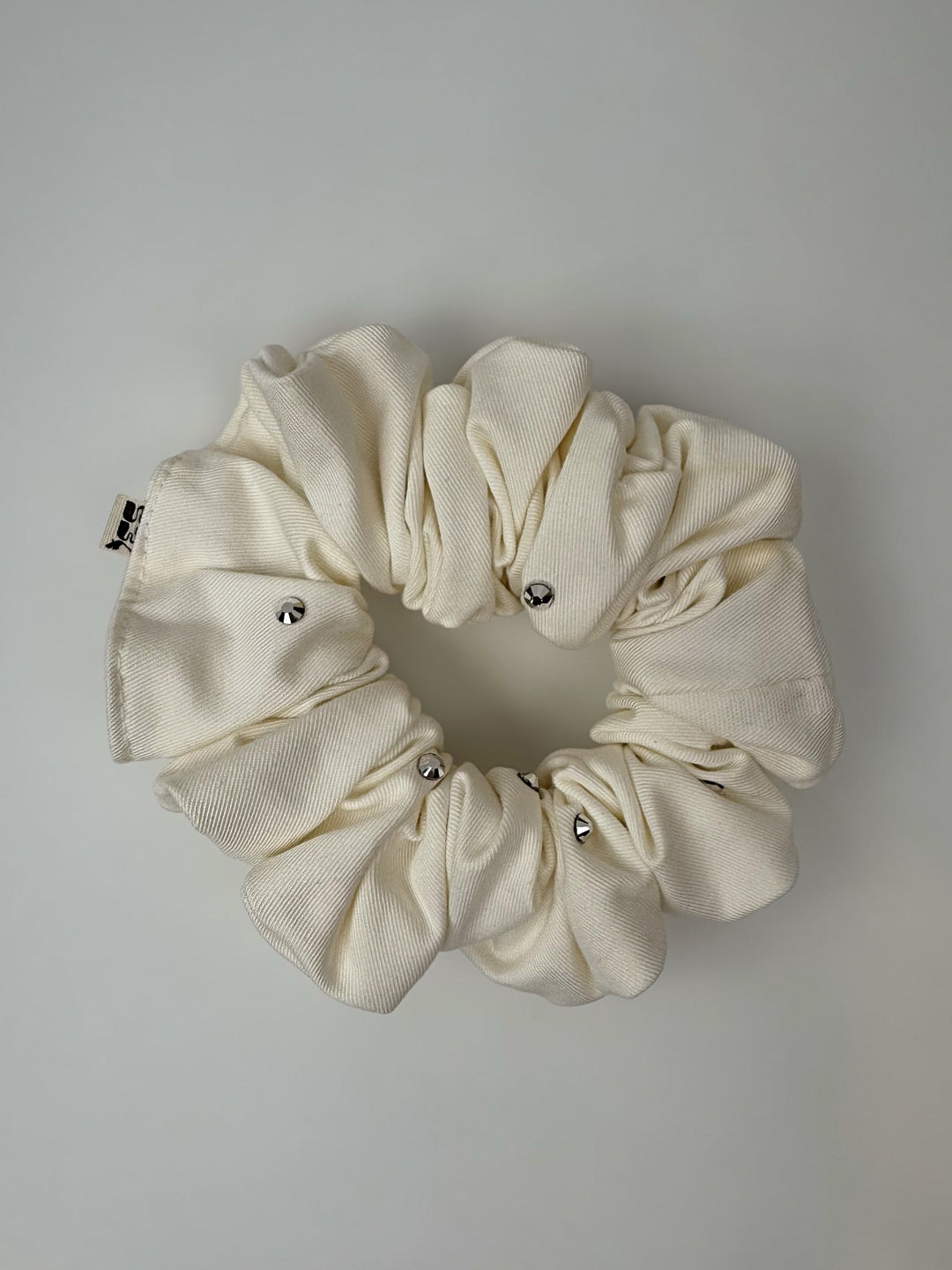 ELASTICO PER CAPELLI IN TESSUTO BIANCO FIRMATO IES